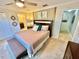 Large main bedroom with a king-size bed and ensuite bathroom access at 4805 Clock Tower Dr, Kissimmee, FL 34746