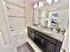 Modern bathroom with double vanity and large mirror at 4805 Clock Tower Dr, Kissimmee, FL 34746
