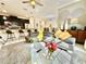 Spacious living room boasts a gray sectional sofa and modern decor at 4805 Clock Tower Dr, Kissimmee, FL 34746