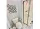 Clean bathroom with a shower and toilet at 4805 Clock Tower Dr, Kissimmee, FL 34746