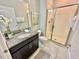 Bathroom with single vanity and walk-in shower at 4805 Clock Tower Dr, Kissimmee, FL 34746