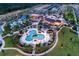 Aerial view of community pool, water features, and clubhouse at 1509 Carey Palm Cir, Kissimmee, FL 34747