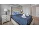 Bedroom with a queen bed and blue and white bedding at 1509 Carey Palm Cir, Kissimmee, FL 34747