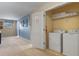 Convenient laundry room with washer, dryer, and shelving at 1424 Rolling Fairway Dr, Davenport, FL 33896