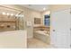 Bathroom with soaking tub and walk-in shower at 1424 Rolling Fairway Dr, Davenport, FL 33896