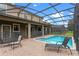 Enjoy this relaxing pool area with patio and seating at 1424 Rolling Fairway Dr, Davenport, FL 33896