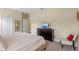 Bedroom with a queen-size bed and a dresser at 1424 Rolling Fairway Dr, Davenport, FL 33896