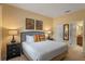 King-size bed in a spacious bedroom with ensuite bathroom access at 1424 Rolling Fairway Dr, Davenport, FL 33896