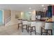 Kitchen with dark cabinetry, stainless steel appliances, and breakfast bar at 1424 Rolling Fairway Dr, Davenport, FL 33896
