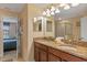Double vanity bathroom with granite countertop and view of bedroom at 1424 Rolling Fairway Dr, Davenport, FL 33896