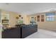 Open living space with sectional sofa and views into game area at 1424 Rolling Fairway Dr, Davenport, FL 33896