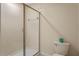 Shower stall with glass enclosure and toilet in a small bathroom at 1424 Rolling Fairway Dr, Davenport, FL 33896
