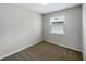 Small bedroom with neutral walls and window at 273 Summershore Dr, Auburndale, FL 33823
