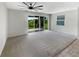 Bright Gathering room with sliding glass doors leading to backyard at 273 Summershore Dr, Auburndale, FL 33823