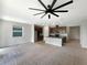 Open concept kitchen with island and dark brown cabinets at 273 Summershore Dr, Auburndale, FL 33823