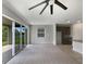 Spacious living area with sliding glass doors leading to the backyard at 273 Summershore Dr, Auburndale, FL 33823