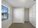Bedroom with double door closet and window at 273 Summershore Dr, Auburndale, FL 33823
