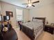 Cozy bedroom with a queen-size bed and built-in shelving at 14198 Alafaya Oak Bnd, Orlando, FL 32828