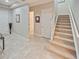 Spacious entryway with tile flooring and staircase at 14198 Alafaya Oak Bnd, Orlando, FL 32828