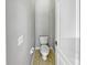 Small half bathroom with a toilet and neutral colors at 10888 Eclipse Lily Way # 62A, Orlando, FL 32832