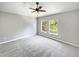 Bright bedroom with two windows and ceiling fan at 10888 Eclipse Lily Way # 62A, Orlando, FL 32832