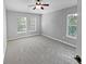 Spacious bedroom with carpeted floor and large windows at 10888 Eclipse Lily Way # 62A, Orlando, FL 32832