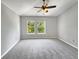 Bright bedroom with carpeted floor and ceiling fan at 10888 Eclipse Lily Way # 62A, Orlando, FL 32832