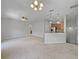 Open living room showcasing kitchen and access to other rooms at 10888 Eclipse Lily Way # 62A, Orlando, FL 32832
