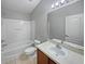 Clean bathroom with a tub, toilet and vanity at 10888 Eclipse Lily Way # 62A, Orlando, FL 32832