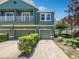 Two-story townhome with a two-car garage and a balcony at 10888 Eclipse Lily Way # 62A, Orlando, FL 32832