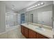 Bathroom with double vanity, tiled floor, and shower/tub combo at 10888 Eclipse Lily Way # 62A, Orlando, FL 32832