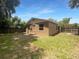 Back of house with grassy yard and fenced in backyard at 2441 Sanford Ave, Sanford, FL 32771