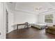 Bright bedroom with wood-look floors and a window at 1100 James Way, Kissimmee, FL 34759