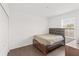 Bedroom with wood-look floors and large window at 1100 James Way, Kissimmee, FL 34759