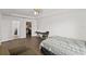 Bedroom with bathroom access and wood-look floors at 1100 James Way, Kissimmee, FL 34759