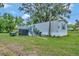 Mobile home with spacious yard, shed, and deck at 1825 Ruby St, Lakeland, FL 33815