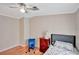 Small bedroom with wood floors and ceiling fan at 1825 Ruby St, Lakeland, FL 33815