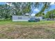 Mobile home with deck and storage shed in the backyard at 1825 Ruby St, Lakeland, FL 33815