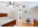 Main bedroom with ensuite bathroom and ceiling fan at 1825 Ruby St, Lakeland, FL 33815