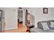 Living room with hardwood floors, comfortable sofa, and view of bedroom at 1825 Ruby St, Lakeland, FL 33815