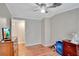 Bedroom with wood floors, ceiling fan, and dresser at 1825 Ruby St, Lakeland, FL 33815