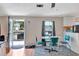 Small dining area with teal chairs and a view of the kitchen at 1825 Ruby St, Lakeland, FL 33815