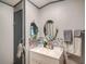 Bathroom with a vanity, tiled backsplash, and a large mirror at 1825 Ruby St, Lakeland, FL 33815
