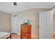 Bedroom with wood floors, ceiling fan, and dresser at 1825 Ruby St, Lakeland, FL 33815