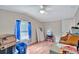 Bright bedroom with wood floors and ceiling fan at 1825 Ruby St, Lakeland, FL 33815