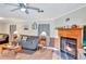 Living room with fireplace, hardwood floors and comfortable seating at 1825 Ruby St, Lakeland, FL 33815