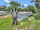 Mobile home with large backyard and mature tree at 1825 Ruby St, Lakeland, FL 33815