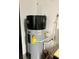 High-efficiency water heater in garage at 1077 Sugar Loaf Key Loop, Lady Lake, FL 32159