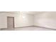 Spacious garage with painted floor and extra storage at 1077 Sugar Loaf Key Loop, Lady Lake, FL 32159