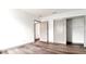 Bright bedroom with wood-look flooring and neutral walls at 1077 Sugar Loaf Key Loop, Lady Lake, FL 32159